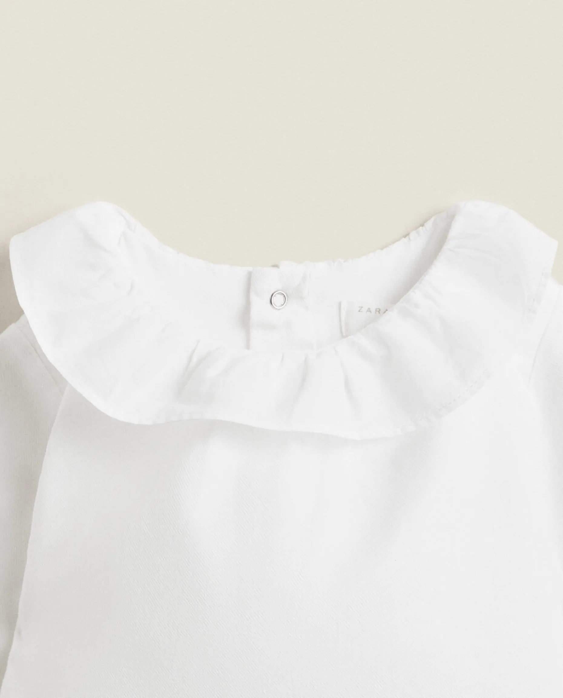 Cotton Bodysuit With Ruffled Neckline